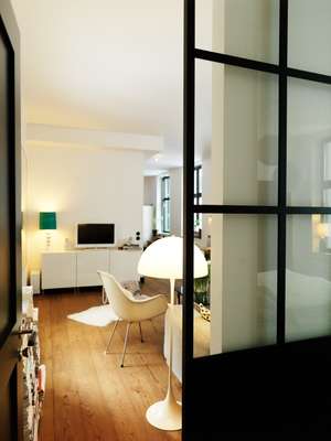 Wester’s bedroom is divided from the living room by heavy Finnish sliding glass doors