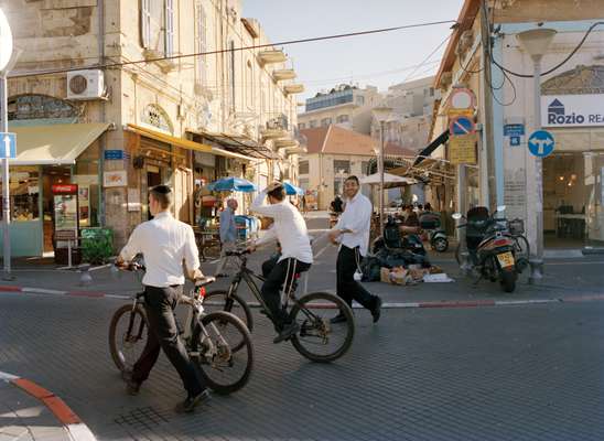 Ultra Orthodox young Israeli Jews walk through Jaffa’s flea market