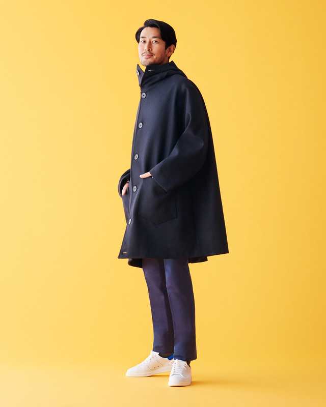 Coat by Cini, trousers by Tomorrowland Pilgrim, socks by United  Arrows, trainers by Golden Goose Deluxe Brand