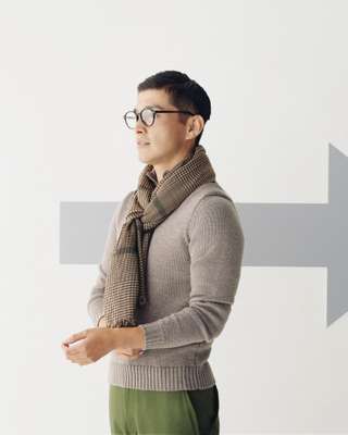 Jumper by Zanone, trousers by Goldwin, glasses by Ray-Ban, stole by Drake’s