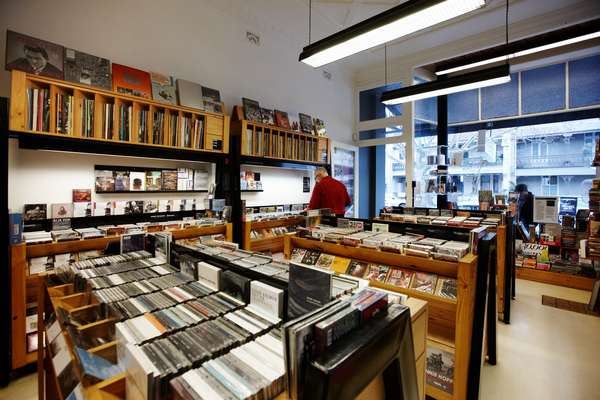 Shelves and racks of music and film neatly clutter TITLE