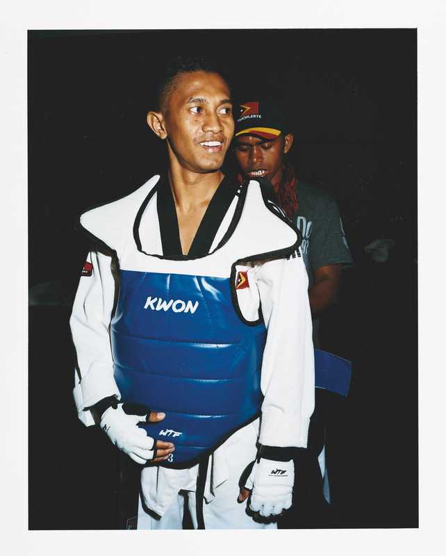 A member of the Timor Leste taekwondo team gets kitted up