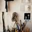 Paint brushes and pencils in studio
