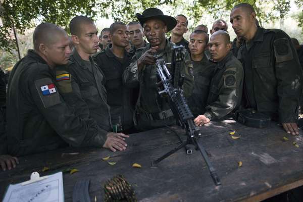 Students learn how to take apart and reassemble a machine gun