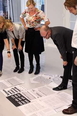 Jens Kajus and colleagues inspecting fonts in the office of e-Types