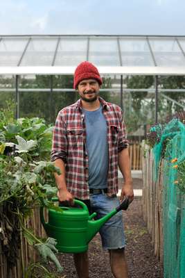 Farmer and agriculture expert Bram Stessels gets watering
