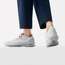 Trousers by Scye Basics, trainers by Nike Sportswear from Atmos 