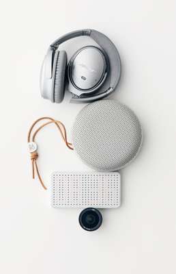 Headphones by Bose, speaker by Bang & Olufsen, mobile battery by Power Cube Pro from Best Packing Store, lens by ExoLens Pro from Best Packing Store