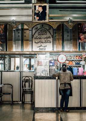 King Mohammed Vi portrait hanging in a café in Casablanca