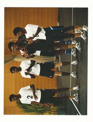 Indian volley ball team subs applaud from the sideline