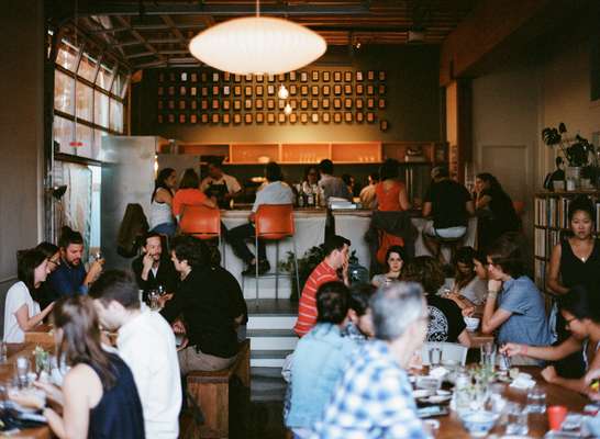 Diners enjoying Korean fried chicken