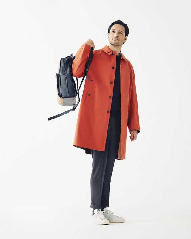 Coat by Mackintosh, jumper by Colmar, shirt by Margaret Howell, trousers by Incotex, trainers by Adidas Originals, backpack by Piquadro