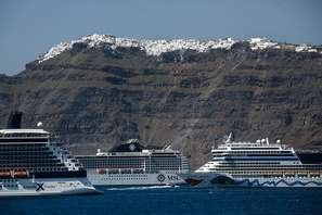 Cruise ships sailing past the Aegean island of Santorini 