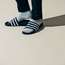 Trousers by Yaeca from Yaeca Apartment Store,  socks by Tabio Men, slides by Adidas Originals 
