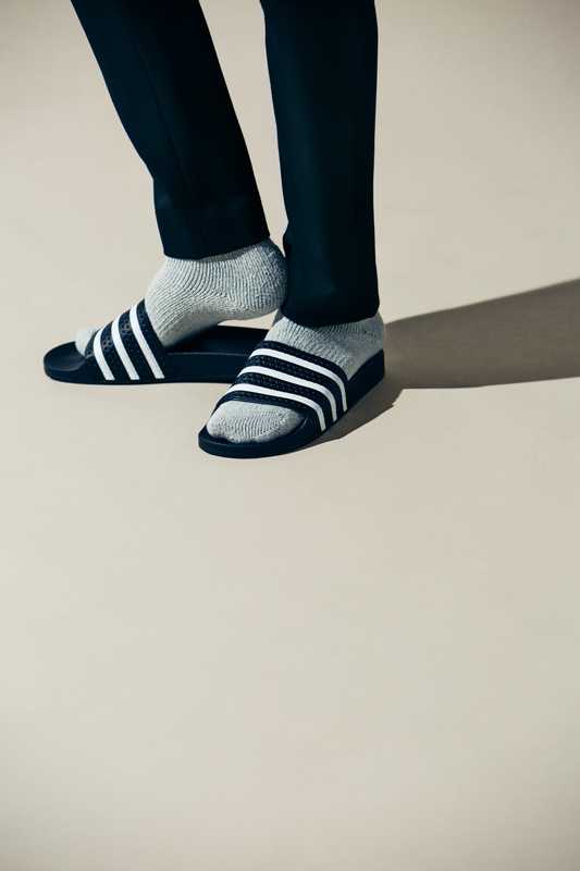 Trousers by Yaeca from Yaeca Apartment Store,  socks by Tabio Men, slides by Adidas Originals 