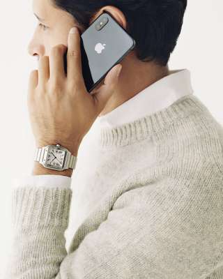 Jumper by Brooksfield, shirt by Golden Goose Deluxe Brand, watch by Cartier, phone by Apple
