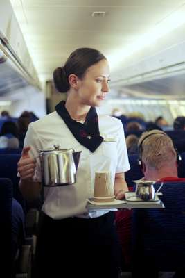  Hostess serves coffee during a FIFO flight