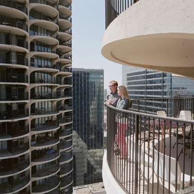 Andrew and Melissa Moddrell on the balcony of their East Tower unit