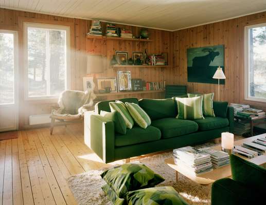The wooden interior is softened with a shaggy rug and plenty of cushions
