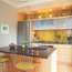 Kitchen with concrete counters and acid-yellow Heath tiles