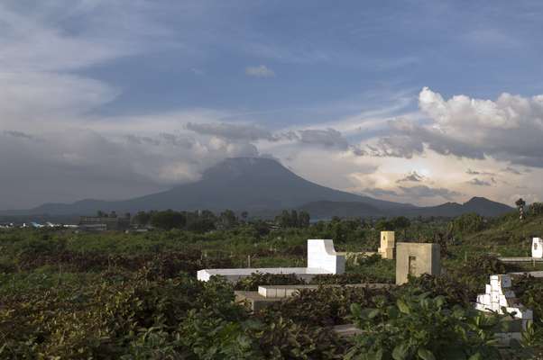 Goma volcano with graveyard in foreground