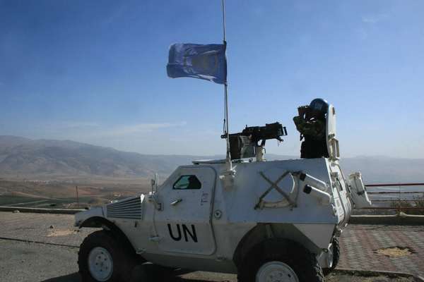 Peacekeeper of the UN Interim Force in southern Lebanon monitors Israel border