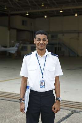 Twenty-year-old Tawfiq Jeneby on the tarmac outside the hangar