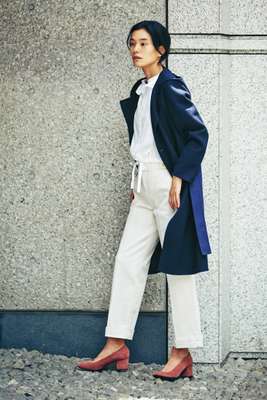 Coat by Sealup, shirt by Atlantique Ascoli, trousers by Scotch & Soda, shoes by Aeyde, earrings by Sarah & Sebastian