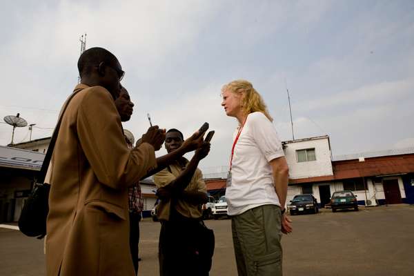 Peg Halloran, a TSA official, talks with local journalists at the airport 