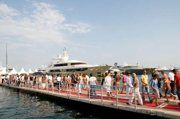 Visitors cross a bridge that can open like a gate to allow boats to pass 