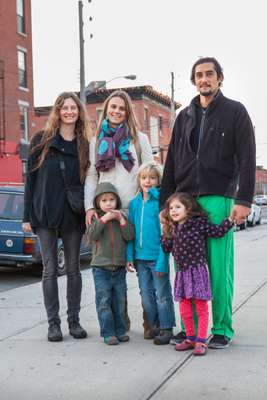 A Red Hook family outside a playground