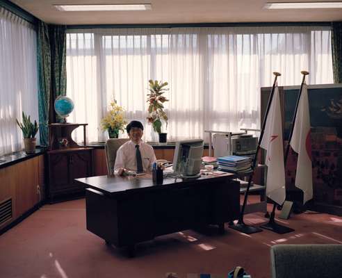Taue in his office