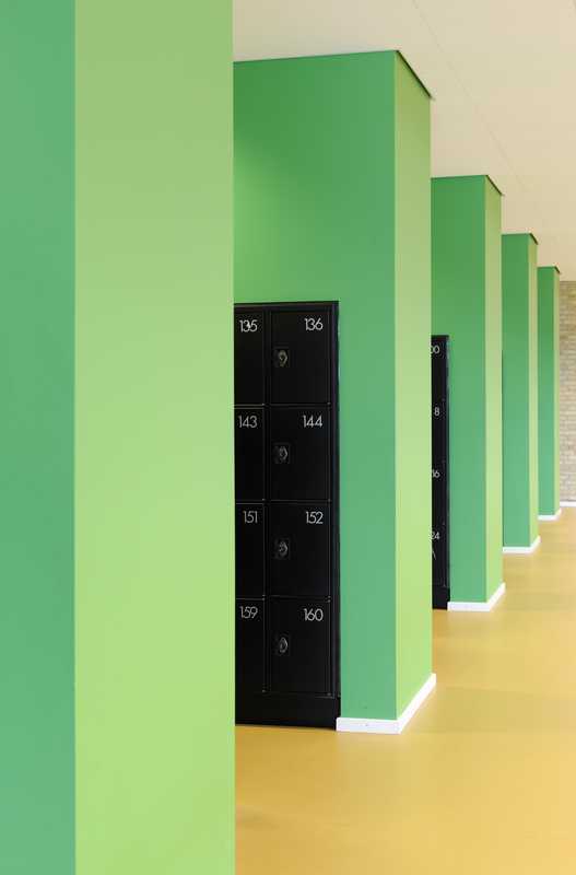 A bright splash of green for the lockers is some of the only colour in an otherwise muted and natural scheme