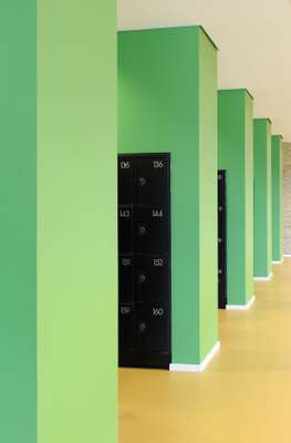 A bright splash of green for the lockers is some of the only colour in an otherwise muted and natural scheme