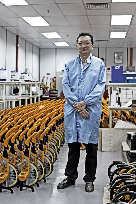 David Lim, manager of a factory that makes distance-measuring instruments for British firm Trumeter 