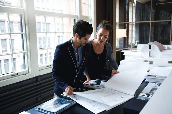 Office 1 (Andre Balazs' Properties, New York): Employees looking over plans  