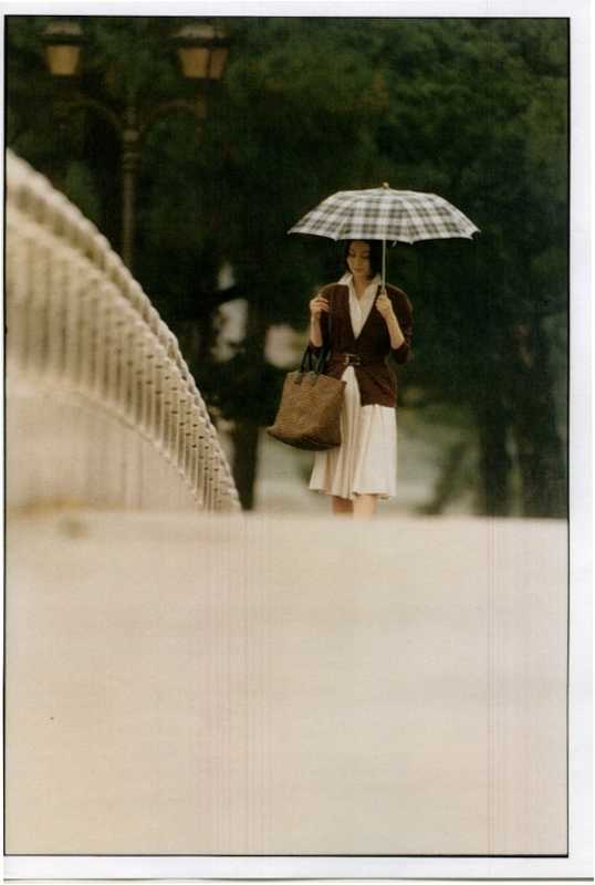 Dress by Salvatore Ferragamo, cardigan by Fendi, bag by Bottega Veneta, umbrella by Traditional Weatherwear