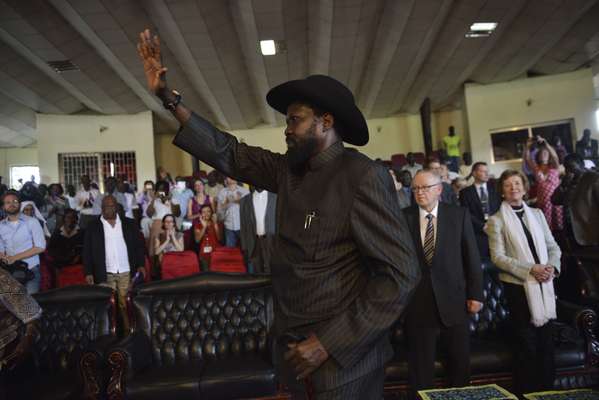 South Sudan president Salva Kiir arrives at a service where Desmond Tutu later made his feelings known