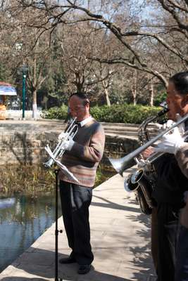 A group of musicians practise at the Green Lake