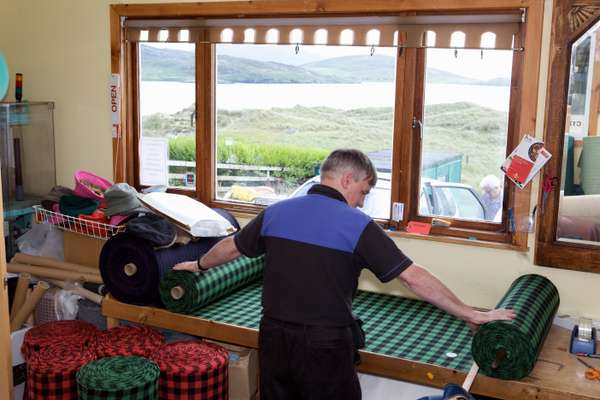 Don Mackay works at home, looking over the beach at Luskentyre