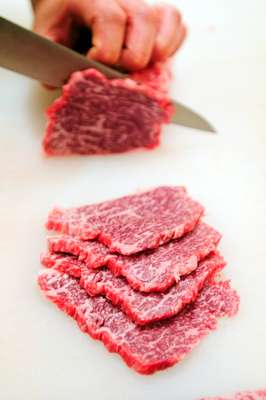 Slicing up good shimofuri (marbled beef)