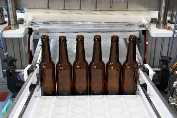 Beers are bottled six at a time
