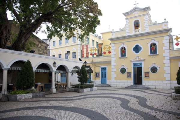 A colonial square with traditional Calçada à Portuguesa paving