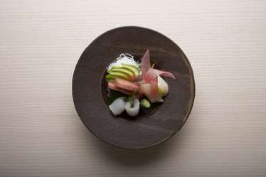 Three kinds of sashimi – Otoro, scallop and turbot on a shiso leaf 