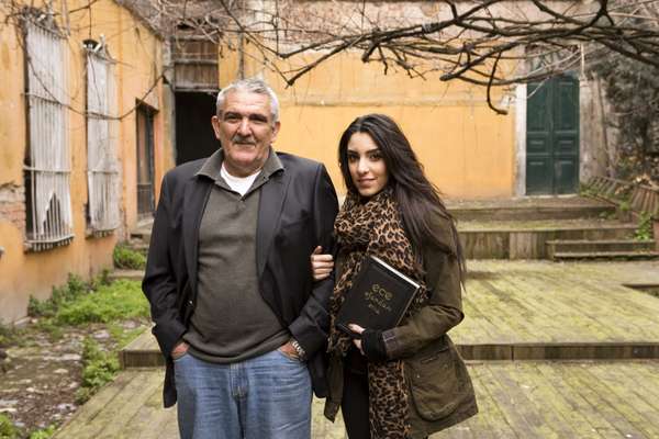 Murat Gunsiray and his daughter Sedef in front of the derelict Ece workshop in old Istanbul