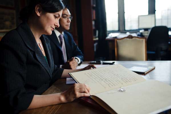 Legal counsels Judith Levine, left, and Aloysius ‘Louis’ Llamzon, right