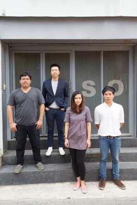 Narong Othavorn  (second from left) with his team outside the  So office
