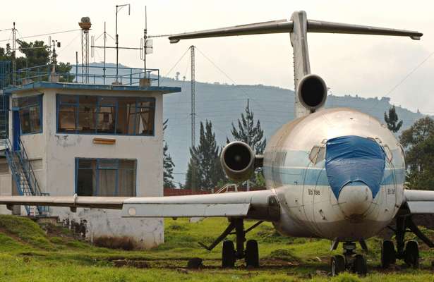 Abandoned plane and tower at Goma airport
