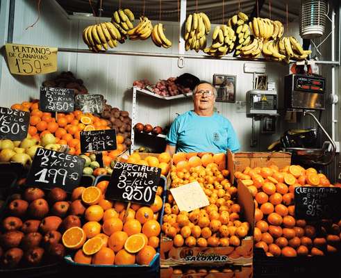 Stallholder in fruit market 