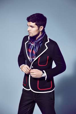 Jacket by Black Fleece by Brooks Brothers, polo shirt by Lacoste, trousers by Boglioli, scarf by Allea, watch by Omega 